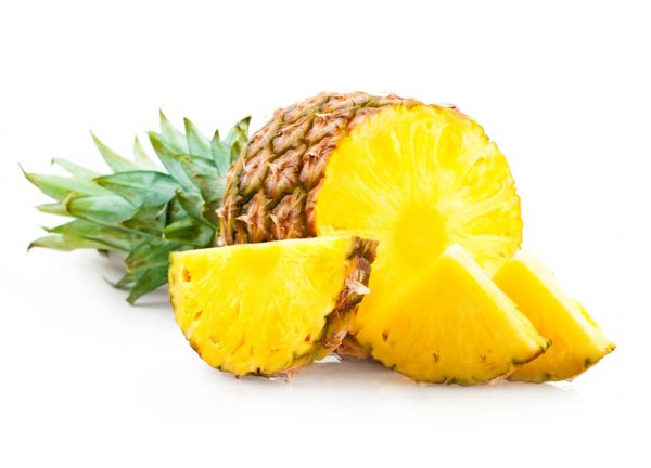 Pineapple with slices isolated on white